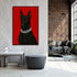 Living room with a large framed picture of a black dog on a red background.