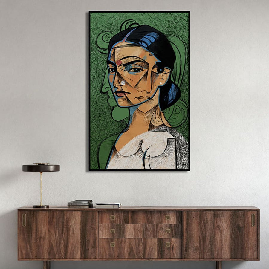 Framed artwork of a stylized portrait on a wall above a wooden cabinet.