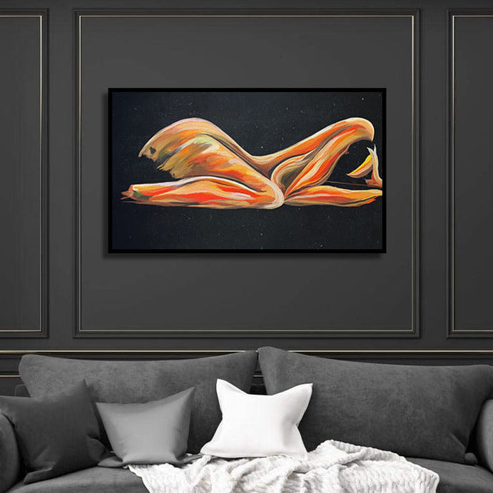 Gray sofa with white blanket and pillows against a dark wall with framed artwork.