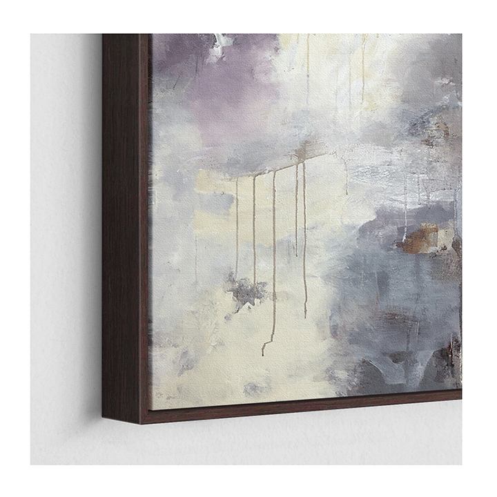 Abstract lavender, gray and cream canvas art in a dark wood floating frame.