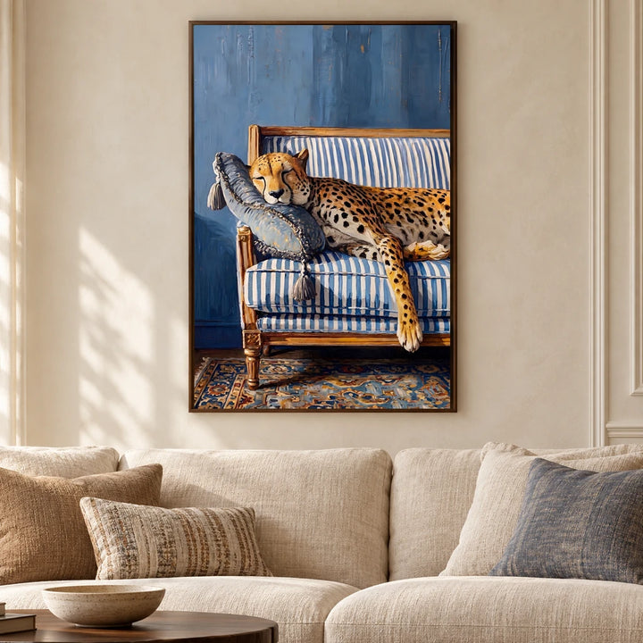 Prince at Rest cheetah canvas in a walnut frame above an ivory sofa in a sunlit living room